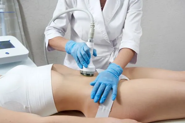 Lost the Weight but Not the Loose Skin? 2 woman having HIFU treatment on her stomach to combat loose skin Leigh-on-Sea following weight loss